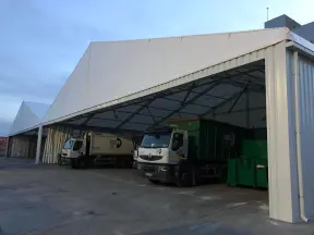 Industrial canopy, with two trucks underneath