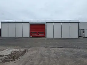 Industrial building with red roller door