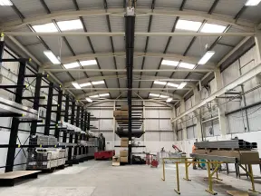 Inside warehouse with racking and stock