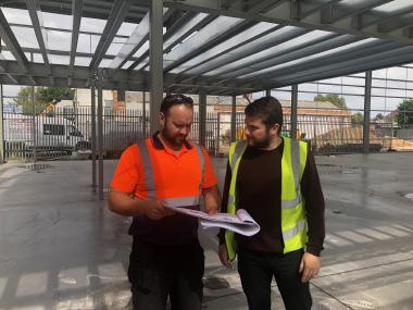Ross Vinter with site manager Dzintars checking Planning Compliance Temporary Buildings Planning Permission and Regulations